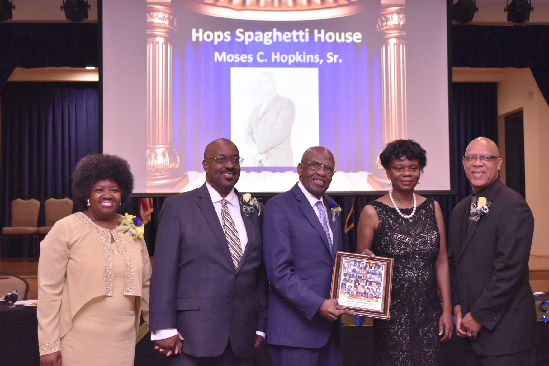 Moses Hopkins, Jr. accepts the Legacy Award for Hops Spaghetti House.